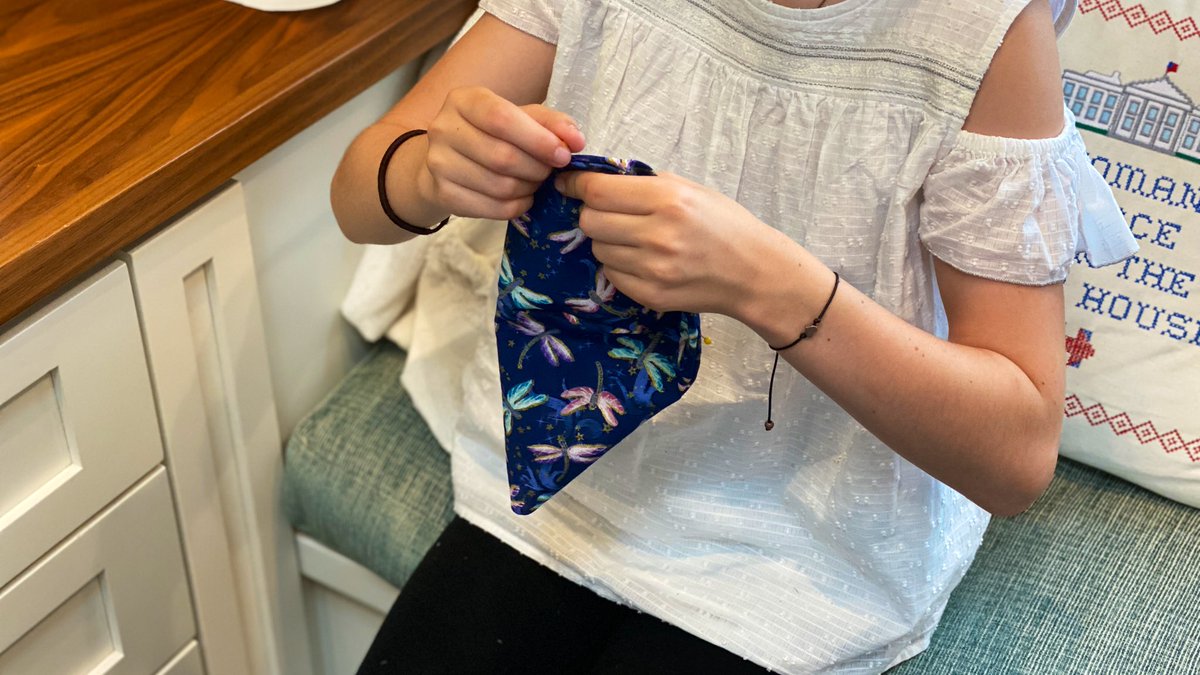 Turning an pinning a new KidCover in prep for final sewing.