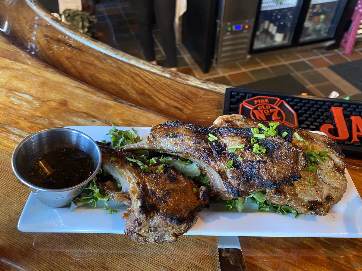 Lamb lollipop appetizer with zesty mint dipping sauce.