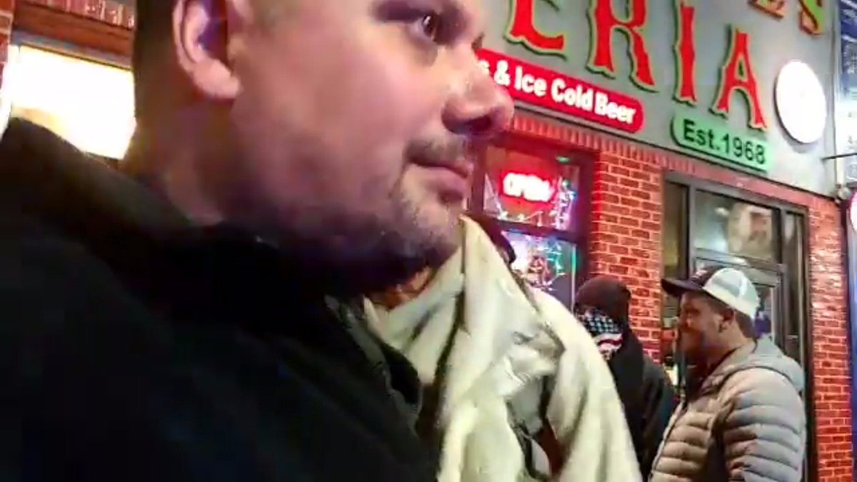 On a lighter note, the hideous gray coat also made an appearance at the Berklee debate debacle (debatcle?) in December 2018. You can see Bartley chatting with some PF guys, even though Mark Sahady's big dumb face blocks most of the shot.