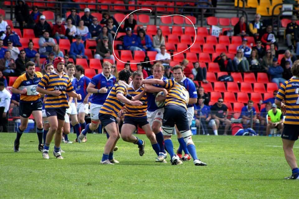 This was one of the last pictures taken of him, sitting in the stands with my mum watching me play. (Yes that's me getting tackled)