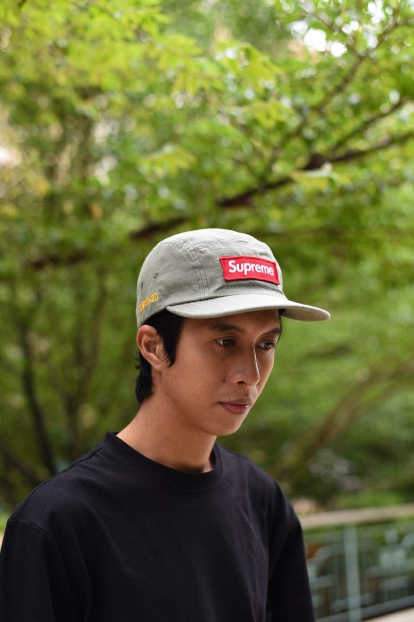 supreme hat on head