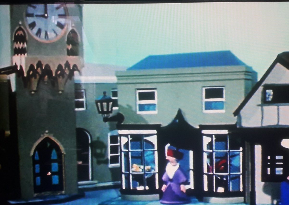 Miss Lovelace& #39;s Hat Shop. Quite an unusual building in that it looks like a more modern construction with an older-fashioned frontage built into it. She always came across as a bit of a pseud, though.