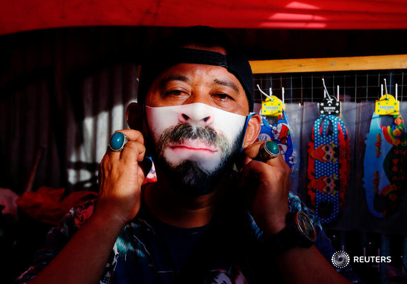 Reuters's tweet photo. With no sign of the global coronavirus threat easing anytime soon, protective masks are fast becoming fashion accessories for Indonesians and Malaysians keen to add some style and humour to healthwear essentials https://t.co/w6luZuTYNh via @yuddycahya @ebrahimharris https://t.co/mJd8HCE6Dc
