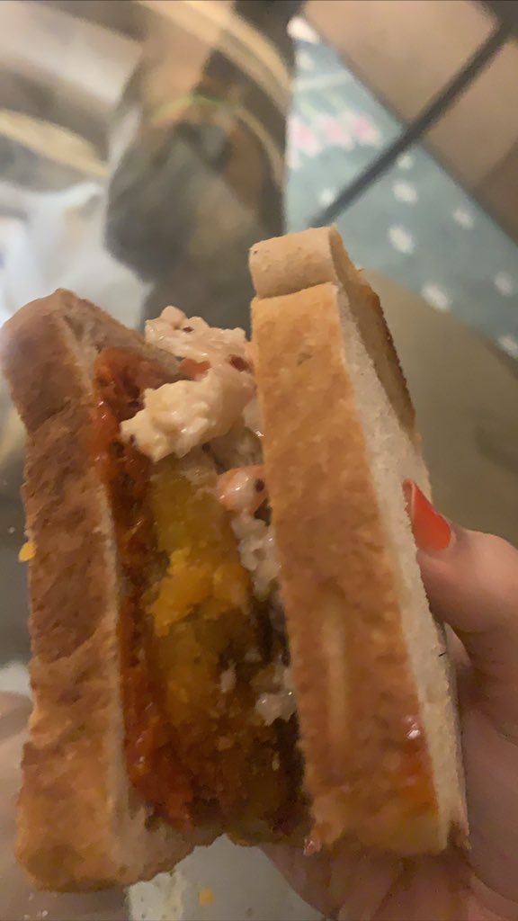 SlashSrishti's tweet photo. Bread chicken burger. #AboutLunch Can you spot my cat in the background? https://t.co/MMZxpe8gme
