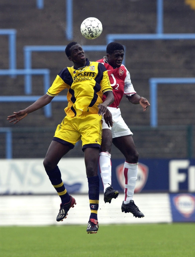 Yaya Toure (Beveren) challenges Kolo Toure (Arsenal) during a pre-season friendly between Beveren and Arsenal on August 5, 2002 in Beveren, Belgium