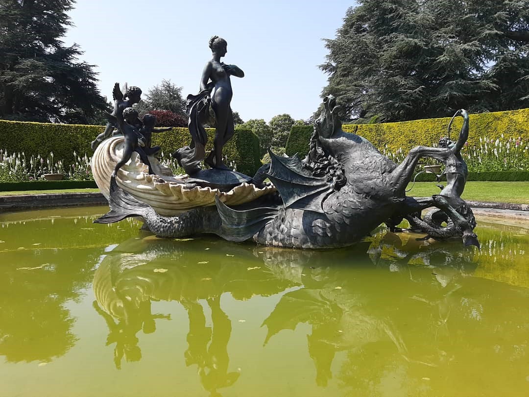 AscottEstate's tweet photo. Another beautiful sunny day. Take in the cooling serenity of the Venus Fountain, made of bronze representing Venus in her shell chariot attended by cherubs created by American sculptor Thomas Waldo Story (1854-1915). Please book online on website #nationaltrust #FridayFeeling https://t.co/ckNZJJwk1L