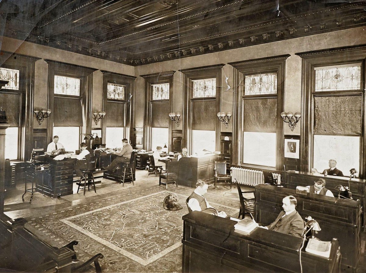 MuseumClock's tweet image. Today is #TakeYourDogToWorkDay ! This early photo taken at the  E. Ingraham Co. in Bristol shows that they had a furry friend who came to visit the offices.