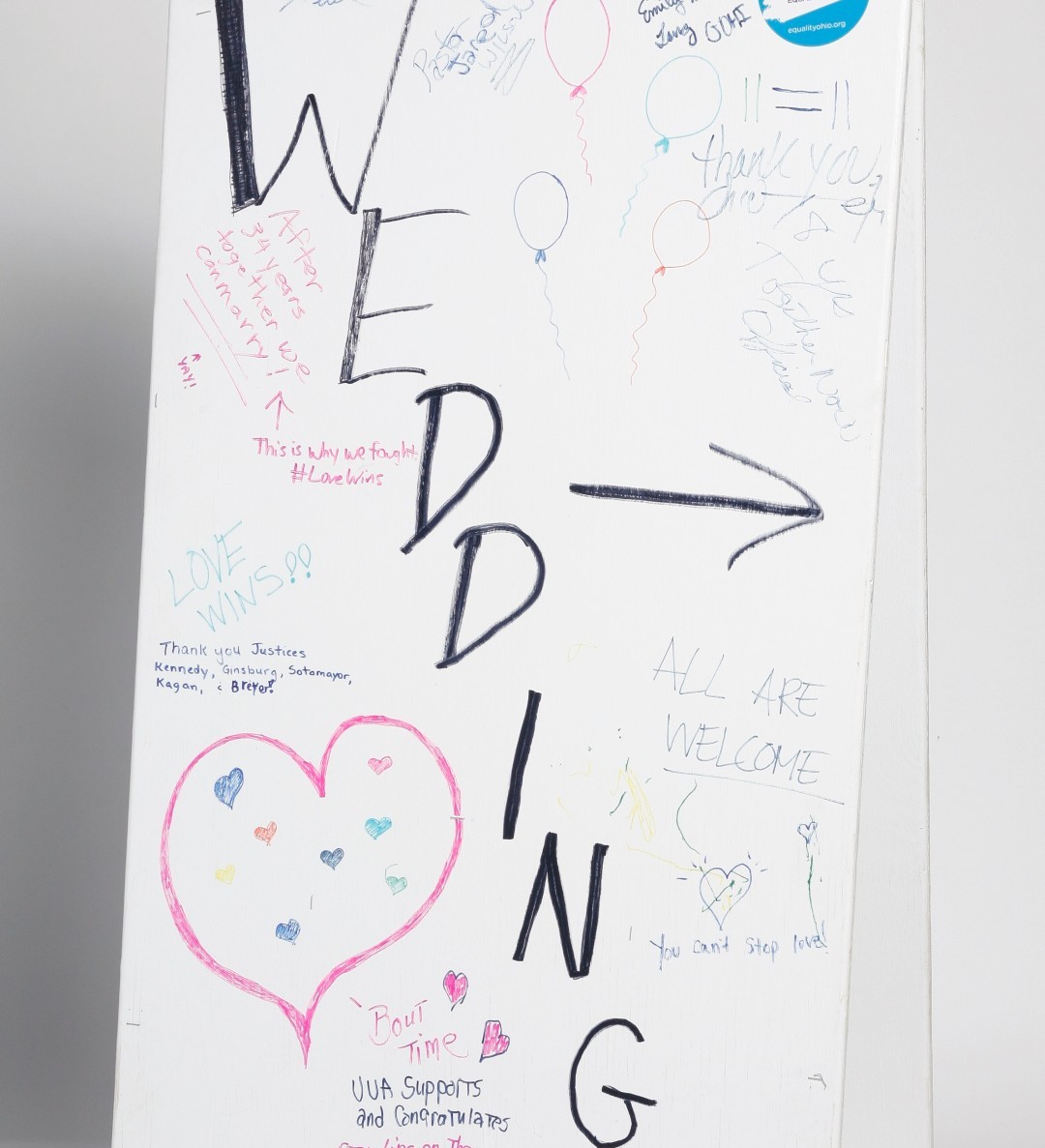 OhioHistory's tweet photo. #OTD in 2015, #SCOTUS overturned nationwide ban on marriage equality. Columbus pastor set up this sign that day to advertise weddings he’d officiate for newly married couples. It’s part of our Gay Ohio History Initiative collection. #ohiohistory #equalityohio #humanrightscampaign https://t.co/Uzhz4WDCjR
