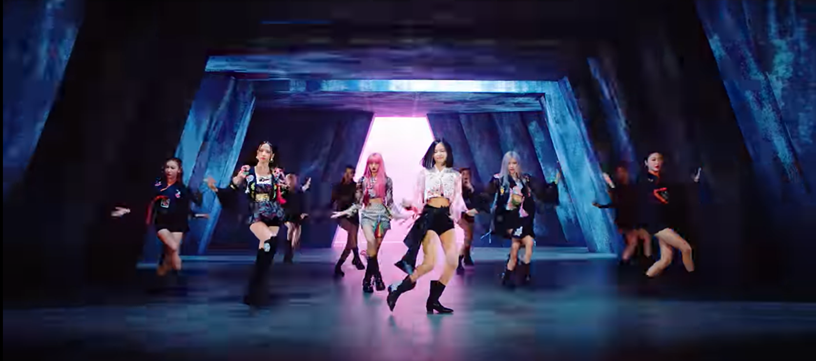 21.This scene has the girls in a dark tunnel with the pink lights at the end, this symbolizes the journey from the dark to the next better chapter.