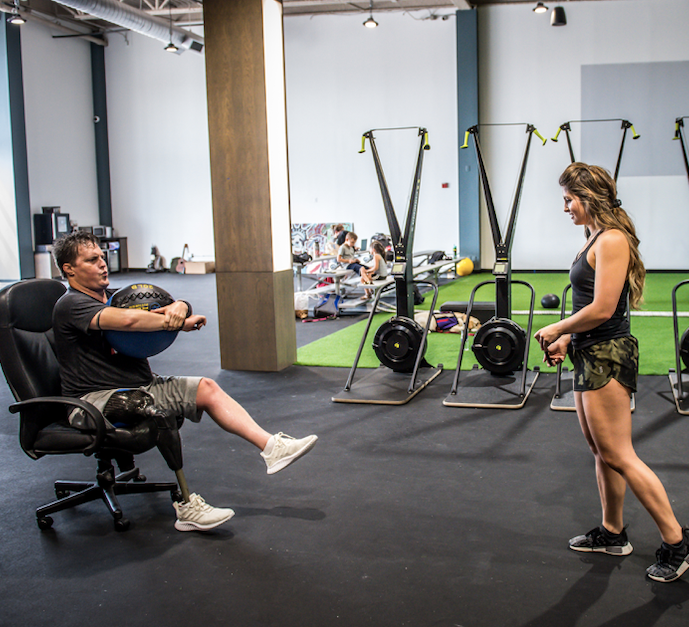 ATF_Tribe's tweet photo. You can still find ways to active your hamstring when you're an above knee amputee, just get creative! #ATF12Brandon is pulling himself with his prosthetic while firing his hamstring into the chair #FeatureFriday #FitnessFriday #ATFtribe #AmputeeProblems https://t.co/5vXRGMI1bF