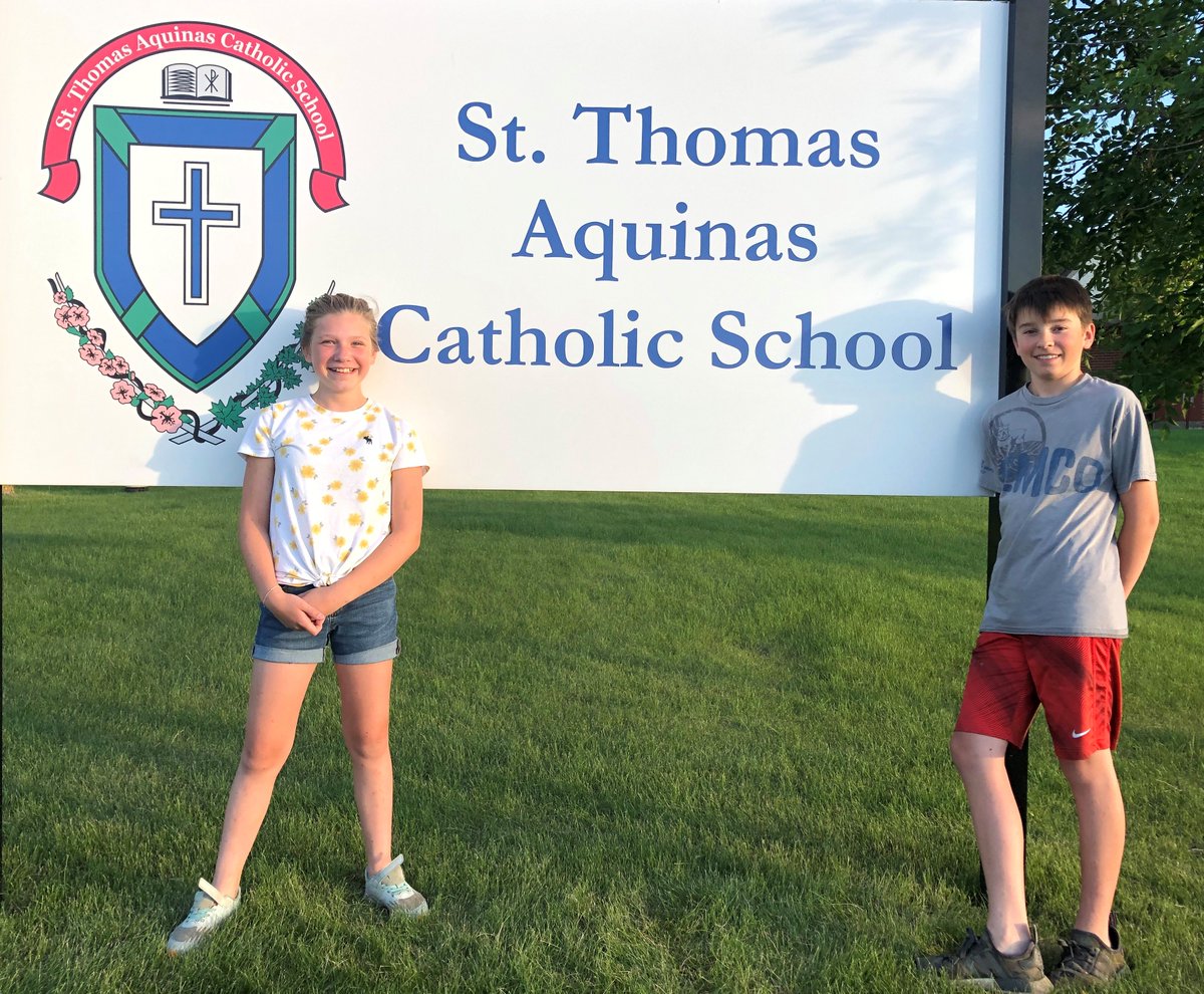 EvergreenCSSD's tweet image. Sister &amp;amp; brother Meagan and Zachary Kroeker, having completed Grade 6 and Grade 8, posed in front of St. Thomas Aquinas Catholic School sign as the sun set on the last day of school. Thanks to their mom Julie Kroeker, an Ed. Asst at STA, for the photo. #ecsrdSTRENGTH @STA_ECSRD