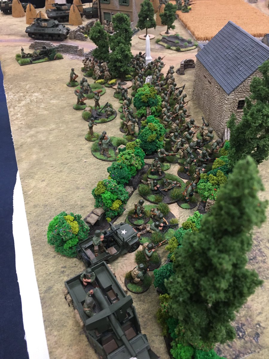 Demonstrating significant material superiority, Allied forces continue to push forward with additional platoons following closely behind the leading elements, awaiting an opportunity to exploit any gaps prised open in the German line.