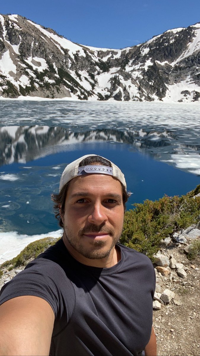 I never do selfies except for that one time I met Archie Manning but anyway I’m by myself so it’s selfies or nothing so here’s a selfie of me in front of this mountain being reflected in a lake and stuff