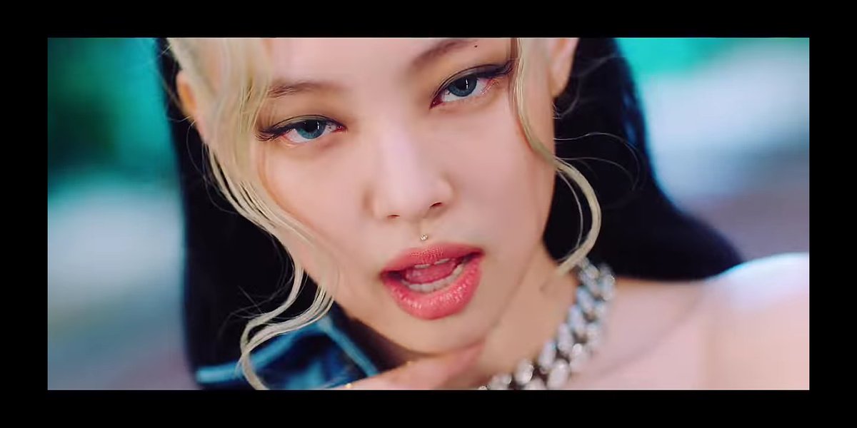 The lil jewel on her cupids bow...the blue lenses...her cat eyes...ALL I KNOW IS PAIN