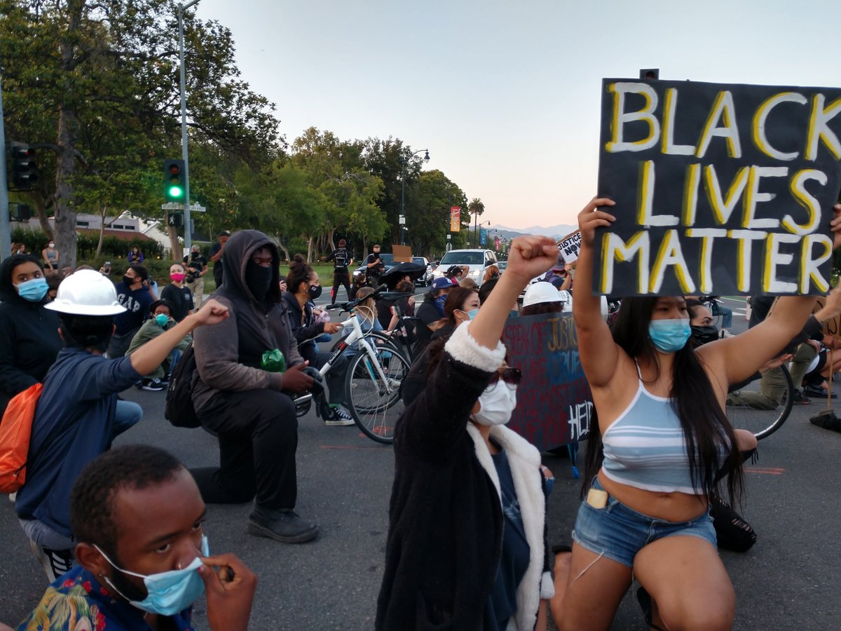 Protesters took a knee, shutting down the intersection in front of civic center