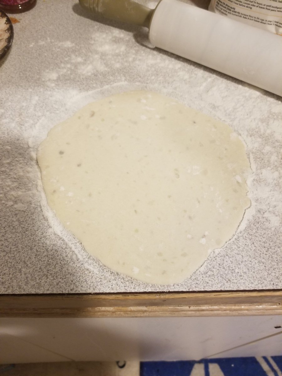 I am still working on getting the texture right, I tend to err on the side of soft dough and just work more in when rolling them out. Take a handful of dough and roll it flat, about the size of a flour tortilla.
