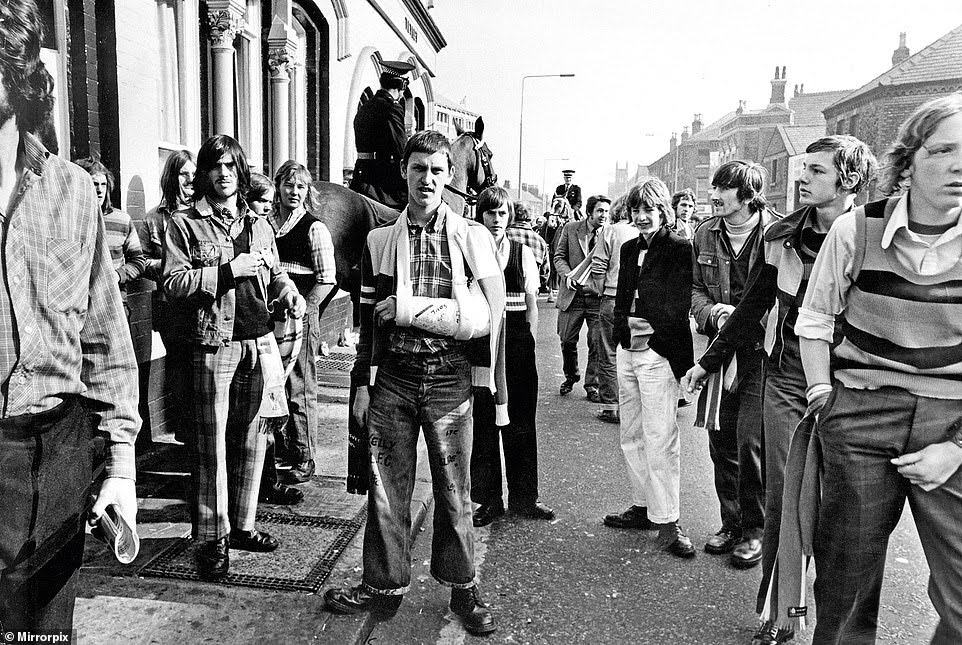 Liverpool supporters on their way to a match in October 1972.Photo Mirrorpix