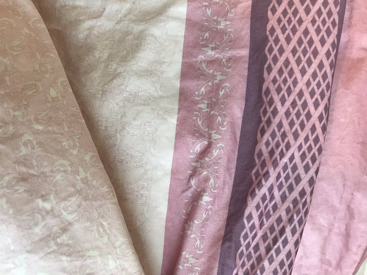 We have 2 fabrics for her this time around, an all over print for the dress, and a border print that includes:-bottom ruffle-bottom trim-lattice work and more than enough pink to make matching bias tape