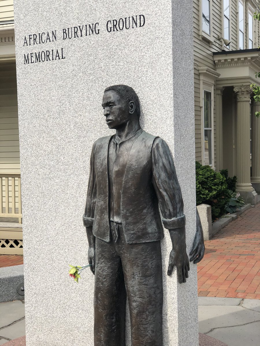 DavidOuellette's tweet photo. @errmm @phil_walters I agree.  Our town of Portsmouth NH put up this statue a few years ago to mark the location of a recently uncovered African burial ground. https://t.co/73ukXKUwl6