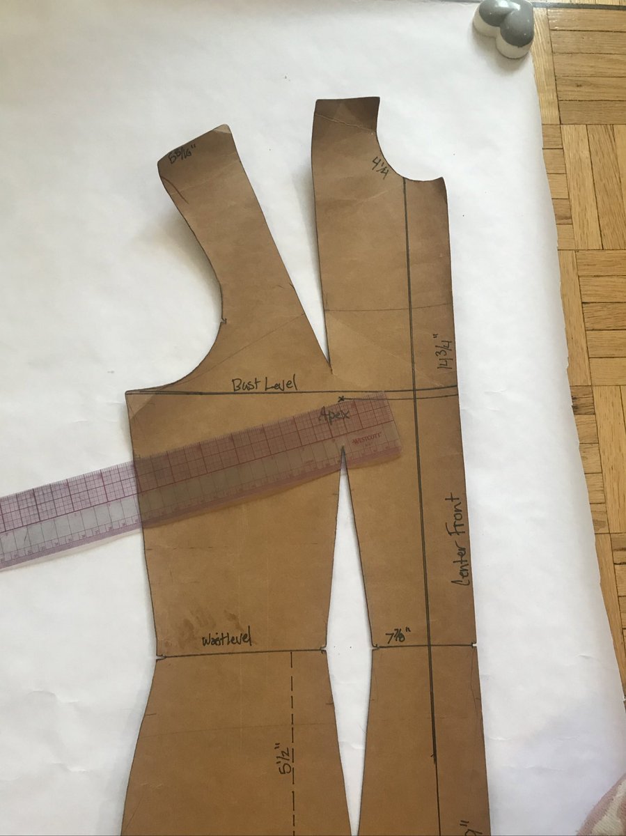 The first thing is to just trace off the blocks. You will need to transfer the bust dart of the commercial patters (where my ruler is) to the shoulder. To do this, find the middle of the shoulder and mark it.