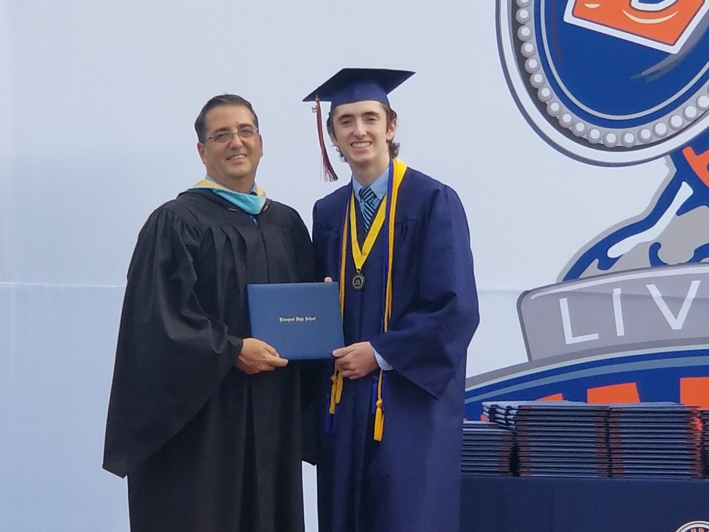 amypento's tweet photo. Huge thanks to Liverpool Schools for making a great graduation experience for the kids. Rick getting to hand @jackpento his diploma was an extra treat. @IthacaCollege, here he comes! One last time on the field before playing for @IthacaSoccer. https://t.co/fKCquyfAaM