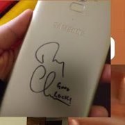 So here's his sign on my phone, don't worry, I covered it so it won't smudge (of course) It says good luck and his tiny handwriting I-