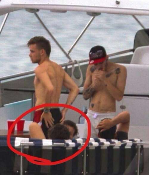 Louis and Harry making out on a yacht PART 2but actually they’re sitting across from each other and Liam is standing in the middle of them.