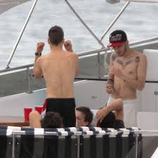 Louis and Harry making out on a yacht PART 2but actually they’re sitting across from each other and Liam is standing in the middle of them.