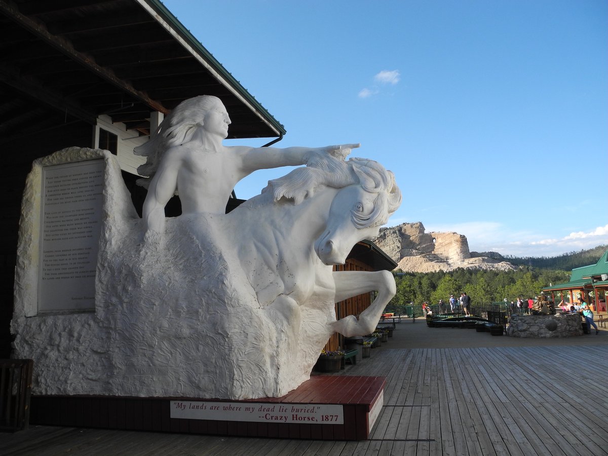 As an adjunct to Mount Rushmore, nearby is another remarkable monument, or at least the start of one. Another mountain is being sculpted into a statue of the Lakota Chief, Crazy Horse, who fought at the Battle of Little Bighorn. The second photo shows how it will look when done.