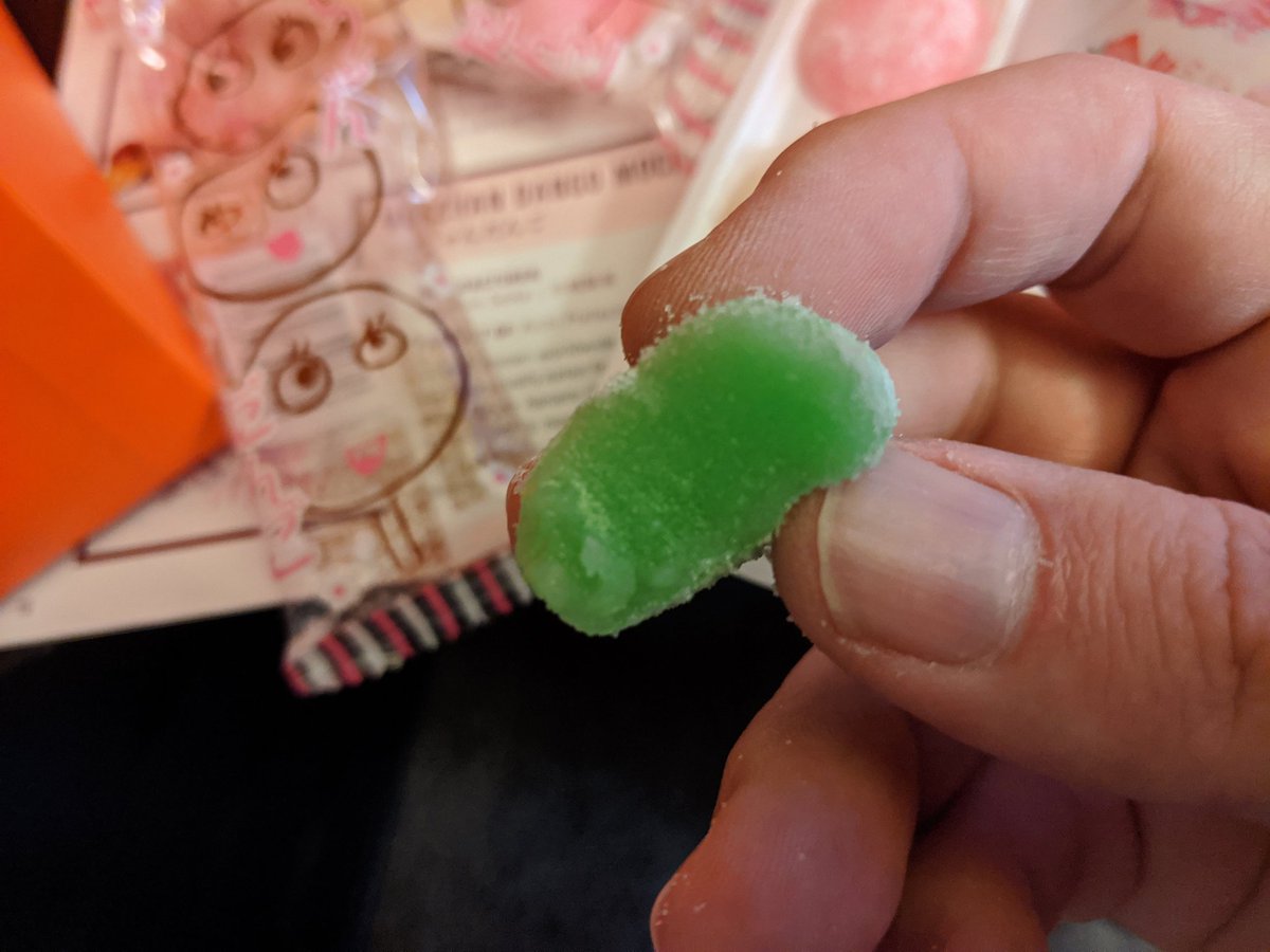 Sugar coated mochi gummy, very soft, very sugary (kind of overpoweringly sugary haha) The colors are subtly tasted differently, but I can't pinpoint the flavors. The red and green are my fav. Not bad.