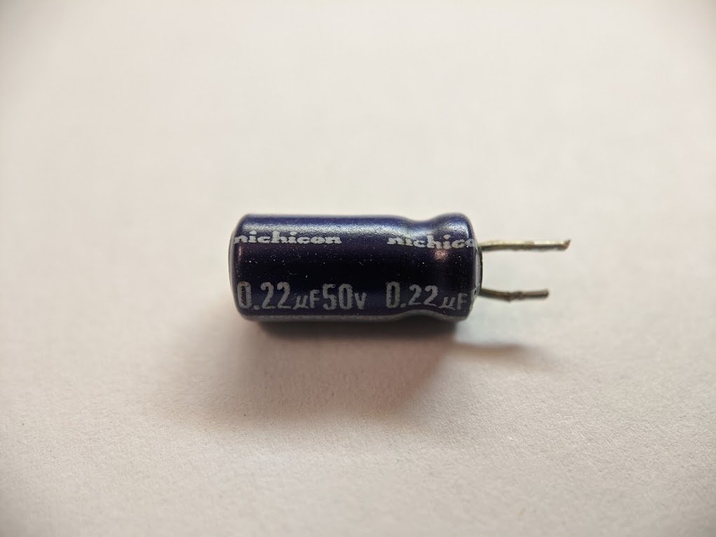 today i took apart some electrolytic capacitors, and learned some surprising things. i wanted to review the manufacturing process, but let's first take apart this capacitor. 