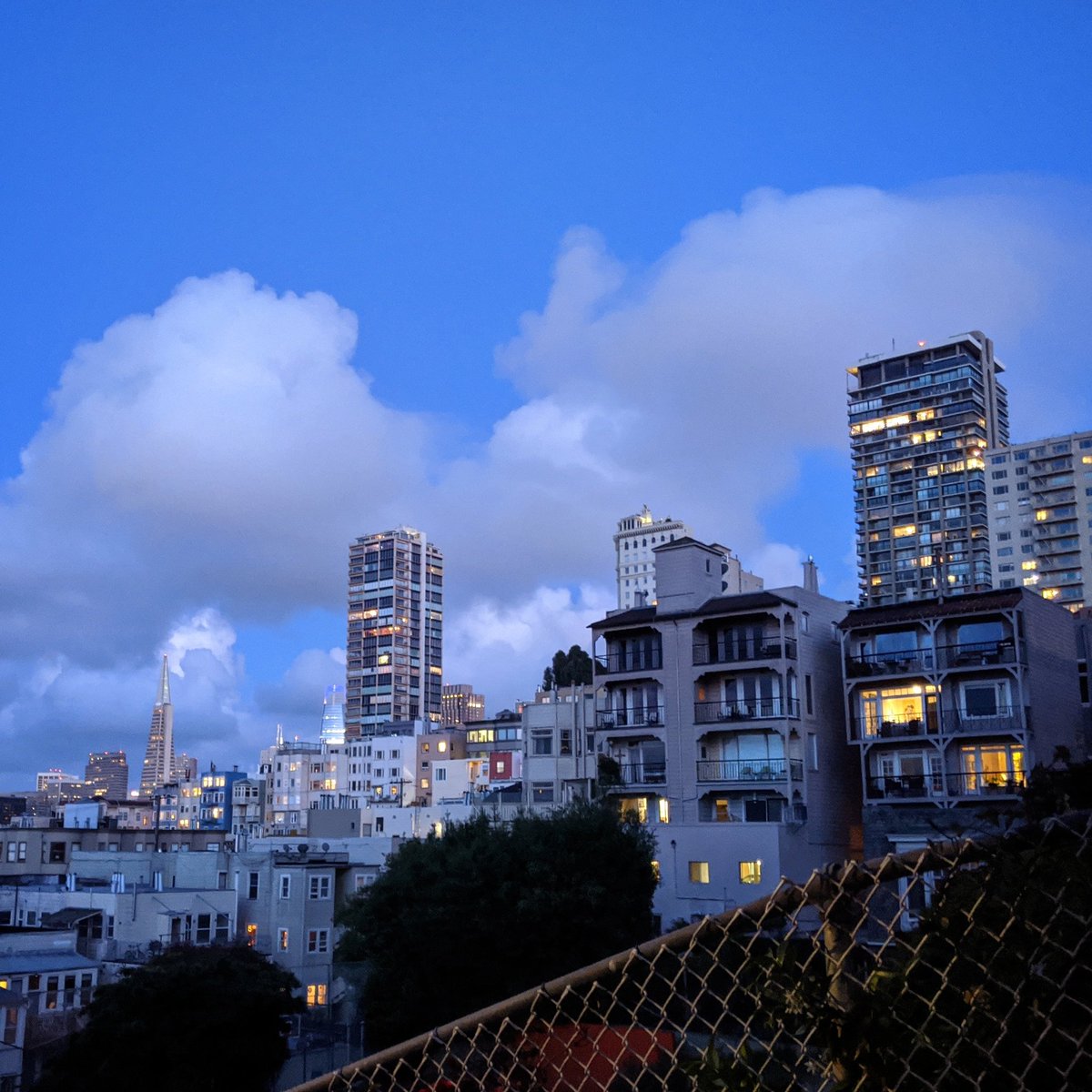 At dusk the little windows start to glow. Life twinkling in the darkness. All different kinds of cozy little homes dotting the sky.The variety of architecture and scale is charming and heartwarming. Why wouldn't we want more?