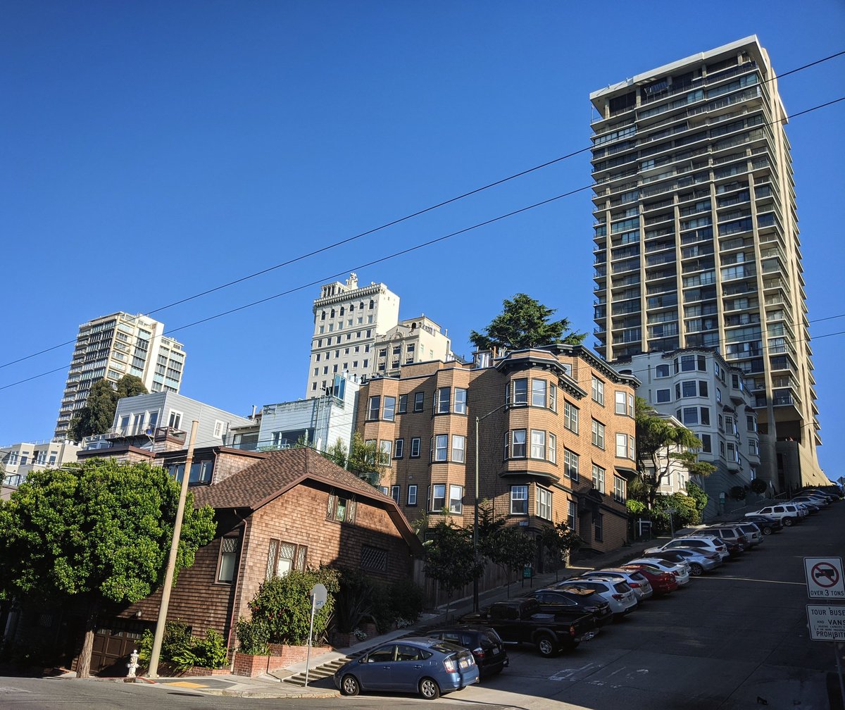 Even slabby concrete and glass towers tickle my fancy. They glow in the evening light. The contrast, the variety of eras and intentions and architectural thoughts make things lively. And sure, the people who live there probably like them as well.Why wouldn't you want more?