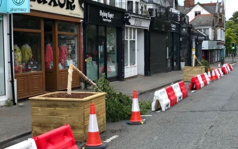 WalesOnline's tweet photo. Trees are snapped and broken less than 24 hours after being placed on a Cardiff street  https://t.co/PdVt4dREhI https://t.co/HPAuGlzOzq