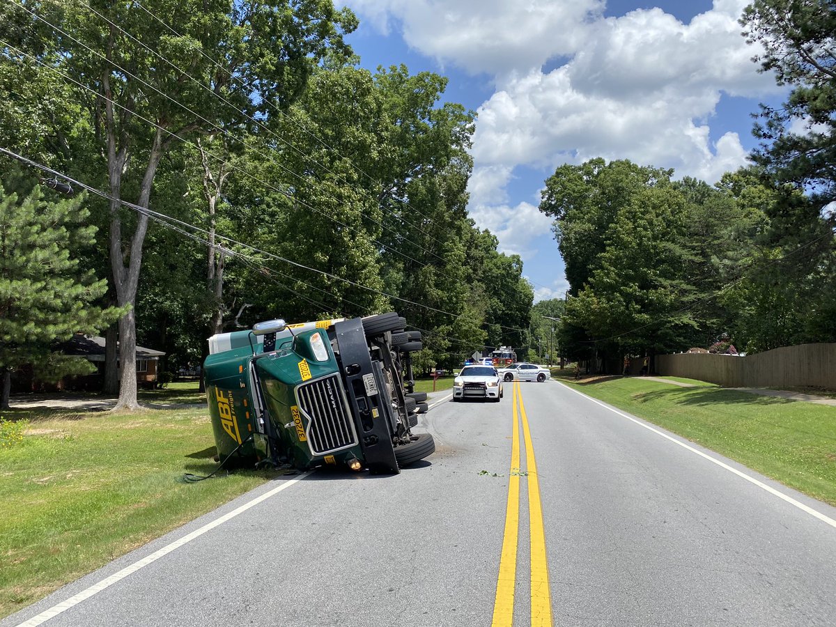 SnellvillePD's tweet photo. No injuries. 

Dogwood east of Mountain View. Truck hit overhead wires. Dogwood closed between Mtn. View and 124. It will be closed for a while. https://t.co/7R11xMtHao