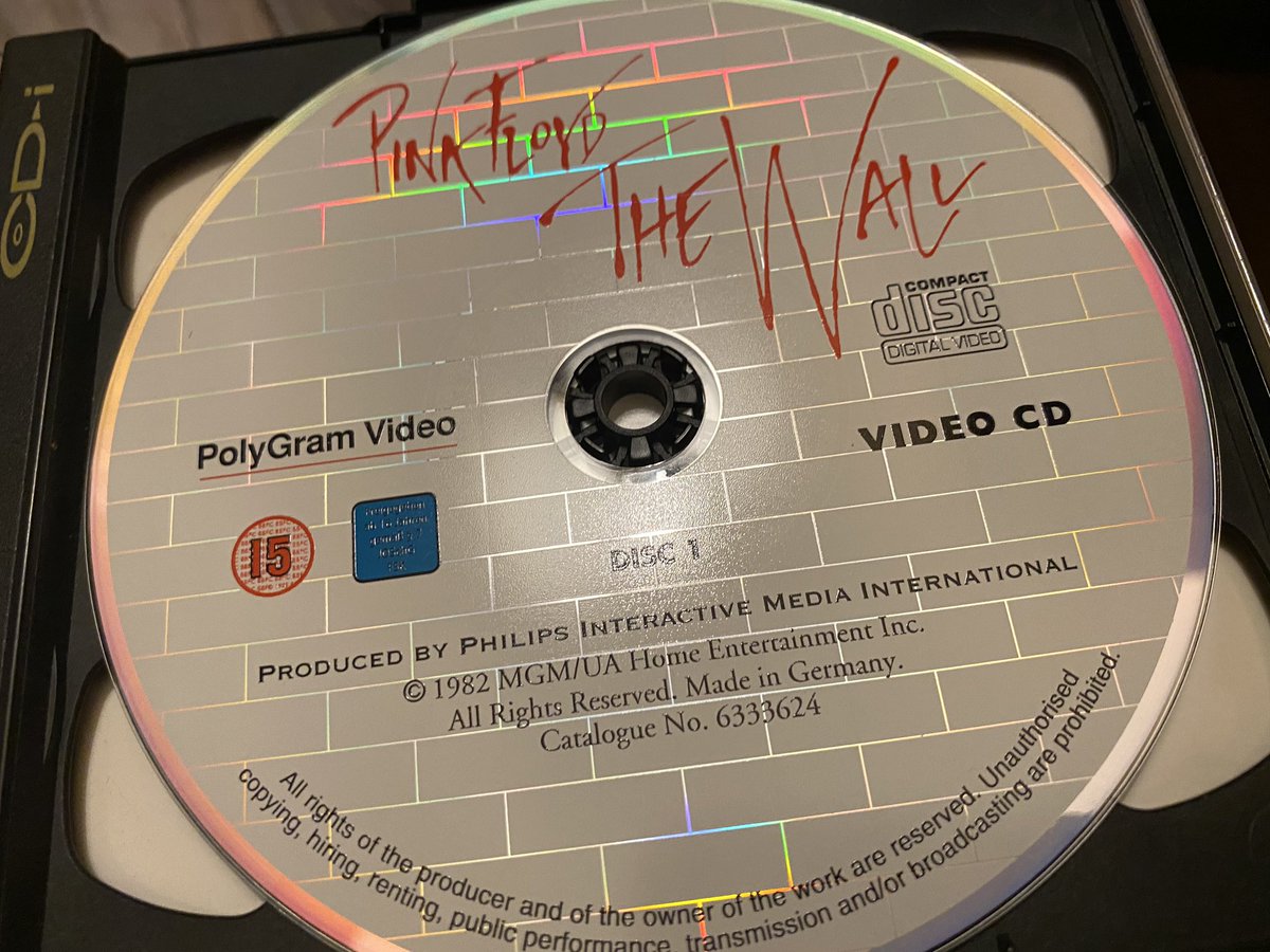 And another arrival. From Polygram Video and Philips interactive Media, the VideoCD release of Pink Floyd: The Wall. 

Looks great next to it’s Big Golden Disc brother. Also inside, Welcome to the new dimension in TV entertainment. VideoCD.