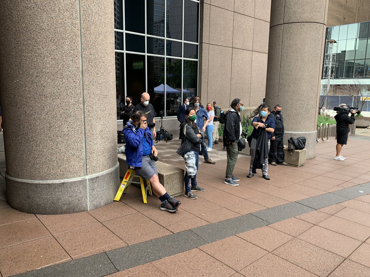 Right now I’m counting close to 60 members of the press, including photographers and crew, outside the jail where the court hearings will be held. 18 reporters will be allowed into the overflow courtrooms.