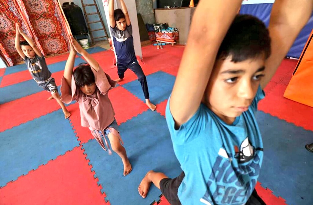 Omar_Gaza's tweet photo. #Gaza children enjoying #yoga &amp; stretching. Made my day. Its a great way to lessen the effect of trauma &amp; #PTSD. 

Pics by Mohammed Asad https://t.co/ydj5tCFH7N
