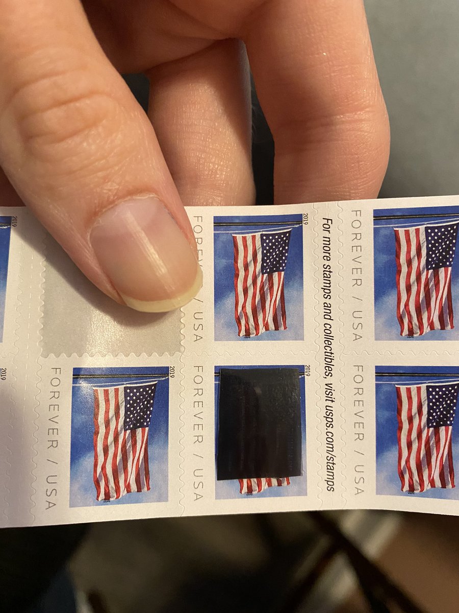 The 2cm "macrodot" is still small enough to be concealed, and can hold an entire page worth of information. It would also fit underneath a standard size postage stamp (true to historic form).