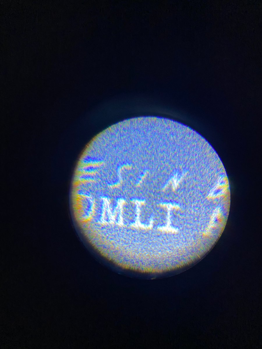 This is a crude attempt, and most of my microscopic dots didn't turn out quite right when looking through my son's hobby microscope, but the slightly larger 1cm dots from the second roll was much easier to read.