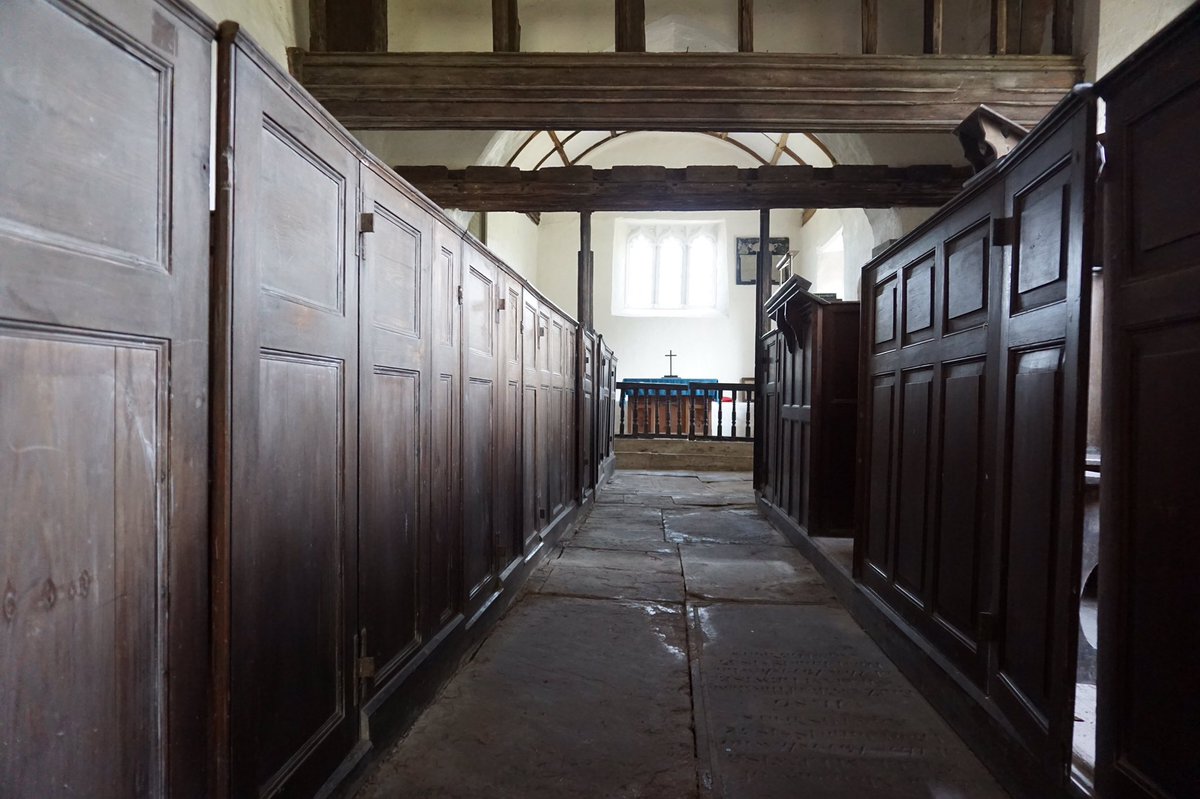 The interior of this tiny church is stuffed with 18th-century woodwork: box-pews, pulpit, altar rail with twisted balusters, and the larger, commodious squire’s pew in the chancel.5/6
