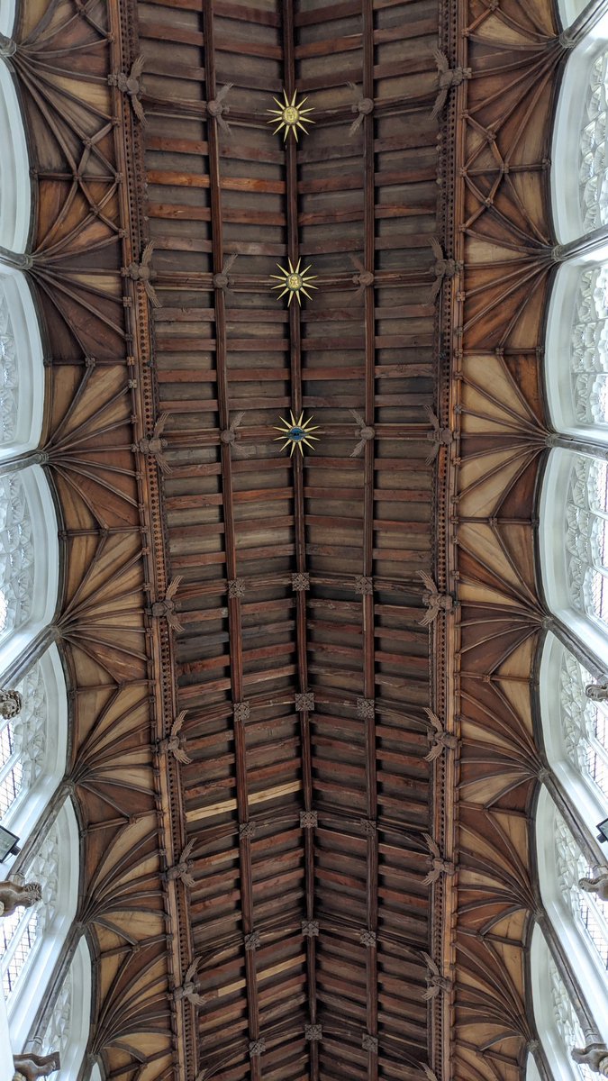 After going down, we went up. The bell ringing chamber has a glass wall now, and through it you can see Mancroft's exquisite hammer-beam roof, with rows of angels on each side. The line between Nave and Chancel is marked by the appearance of gilded roof bosses and extra angels.