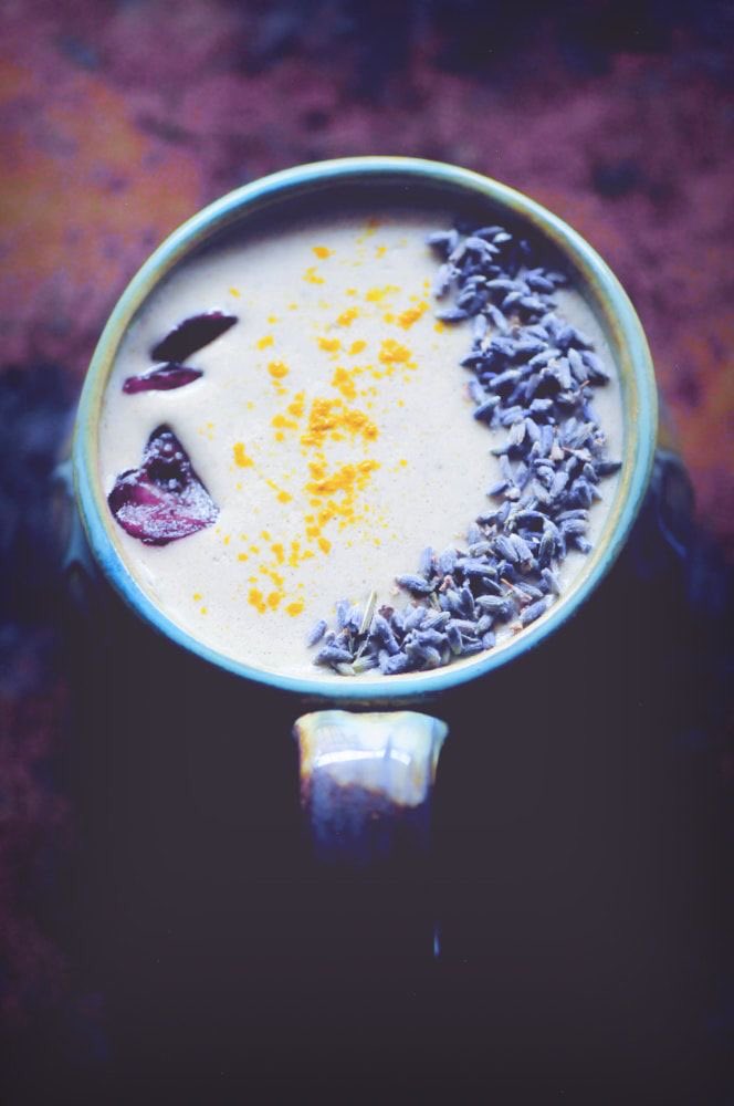 lan jingyi, ma boi, is this not only aesthetically pleasing but also RICH AF cup of tea— it's called the cherry lavender moon milk tea! it's made of fresh sweet cherries, grind ginger, and dried lavender buds. the yellow on top is his sass- ground turmeric! rich and strong!