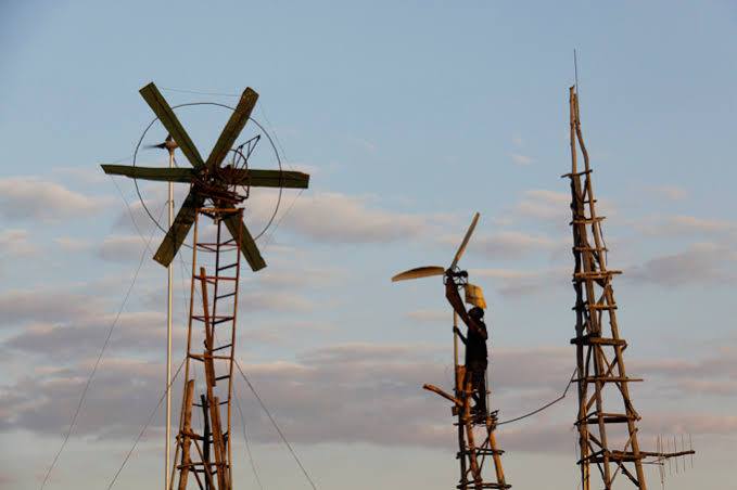 Malawi's William Kamkwamba provided electricity for his village with windmills built from scrap at age 13 in 2001.He dropped out of school over the failure to pay fees & read a library book about windmills.He built a water pump & 2 wind turbines for his people in his village.