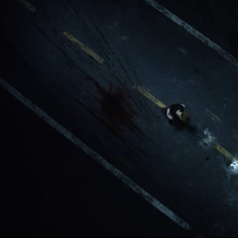 Like we saw, this scene took place in TN and is Yook's reunion after 2 years, when YG is drunk and almost hit by a car before meeting JK at the music shop. However, the big stain of blood means there was a collision so i think it refers to JK's accident too.