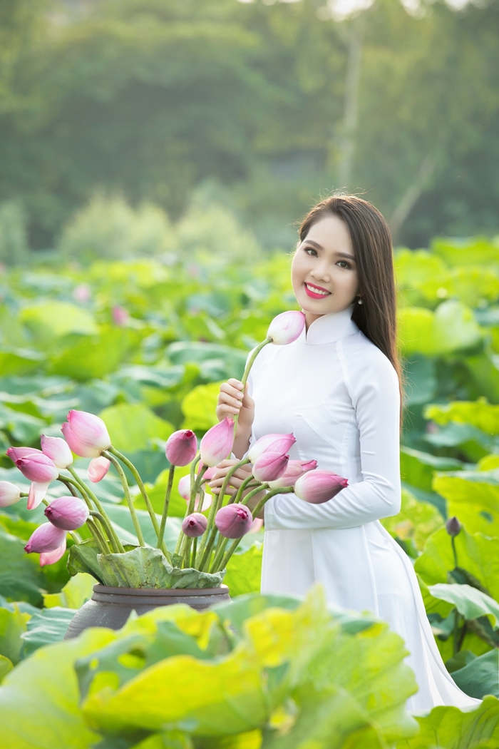 Áo dài with the lotus, which is not officially recognised but generally seen as the national flower of Vietnam.The conventional colour for áo dài in this case is white.