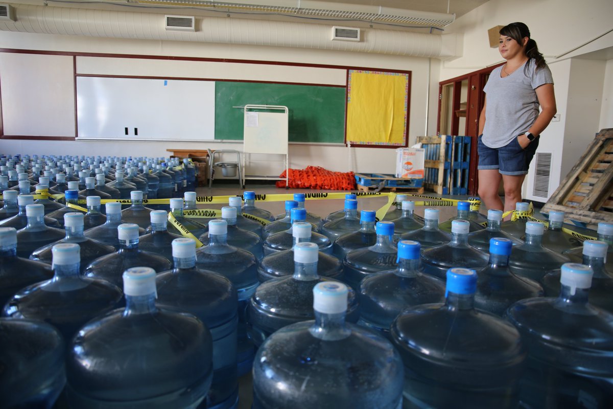 Last year, vols turned an old reservation school into a water distro center. Teens sacrificed their summer to carry around heavy jugs. Teacher Dorothea Thurby guessed she hand lifted 1,000 lbs/day. (furloughed from her job b/c boil notices trigger the daycare / pre-K closing.)