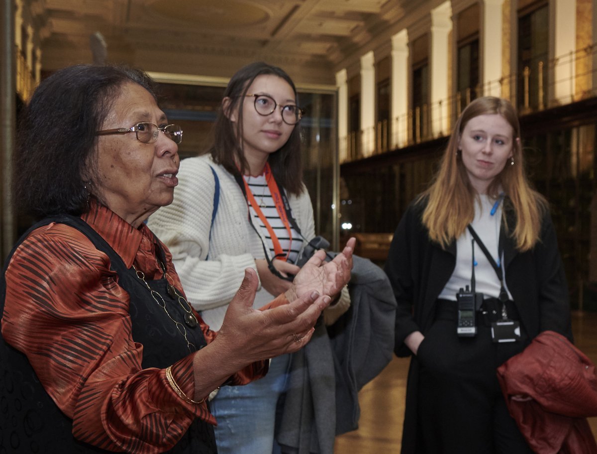 A volunteer leading a tour in the Enlightenment gallery.