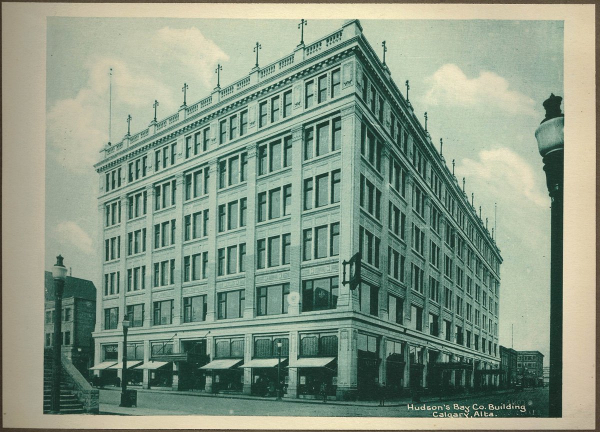 The Hudson's Bay Company Department Store (1913), built 1911-13, and significantly expanded in 1929 and 1956-57, is a monumental, six-storey, Commercial-style building, clad in ornamented, cream-coloured terra cotta.