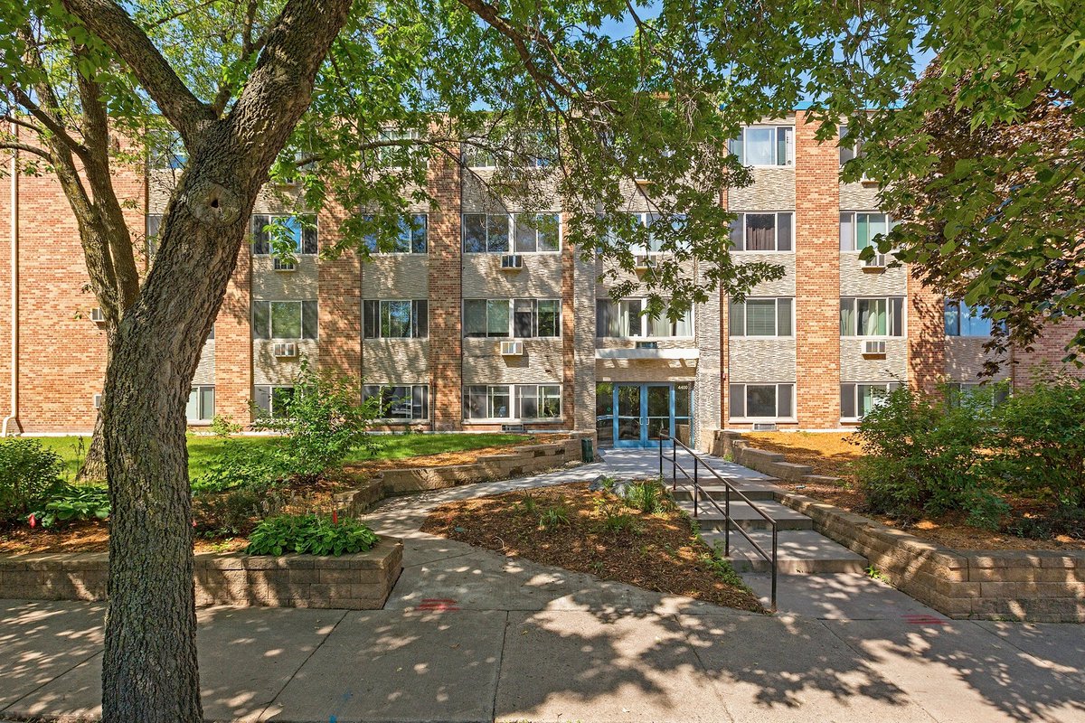 Tim: is this a condo? Jane: It is a condo. It's a 3 bedroom, 2 bath condo filling in at 1160 square feet. Plus it's under your budget at $242k. Heather: wow that is so under budget. I am digging the modern look too. Tim: It looks kinda like a school. Jane: Let's go inside!